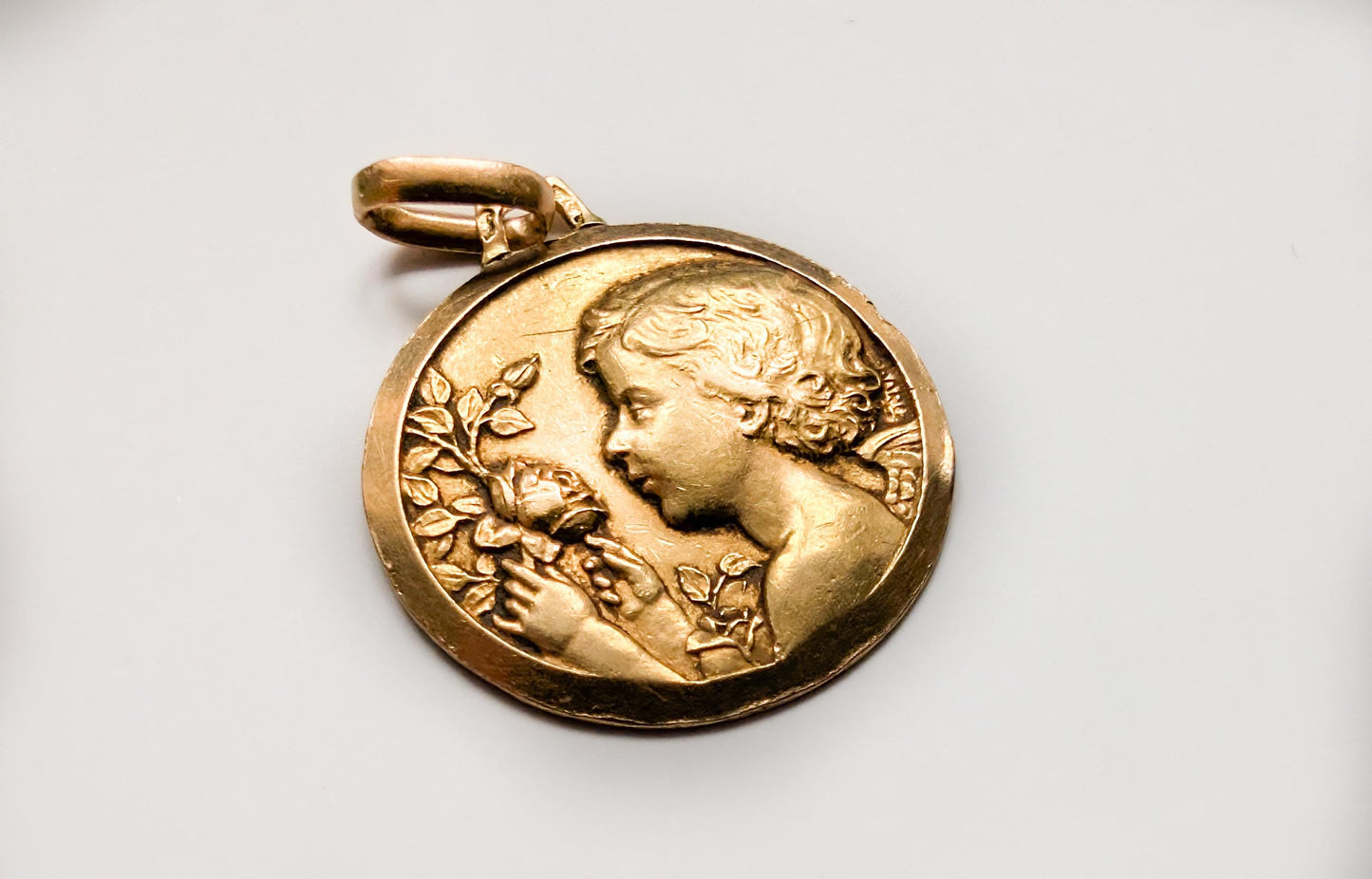 3g 18K Antique cherub angel shown in half-relief resting on clouds , Vintage 18K baptism medal, antique gold baptism gift